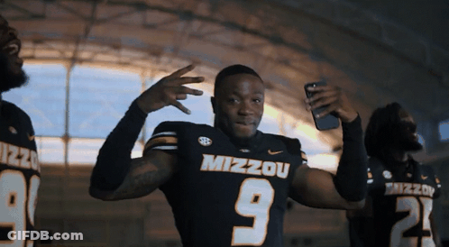 Man In Mizzou Jersey Taking Selfie GIF