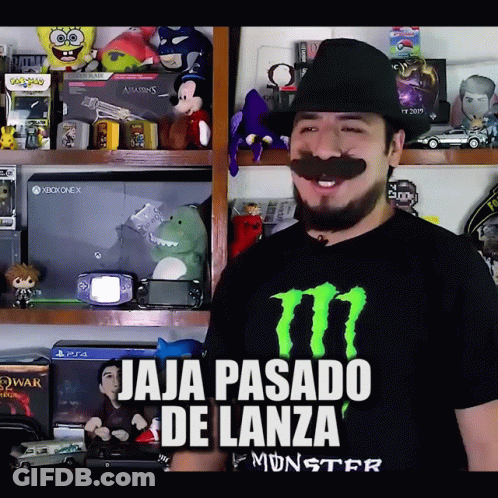 Man In Monster Shirt In Front Of Video Games GIF