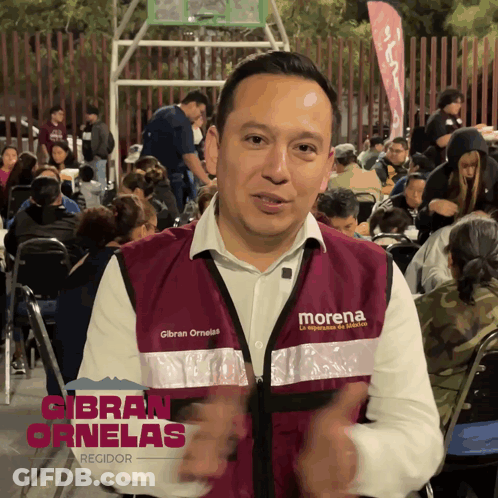 Man In Morena Vest With Crowd GIF
