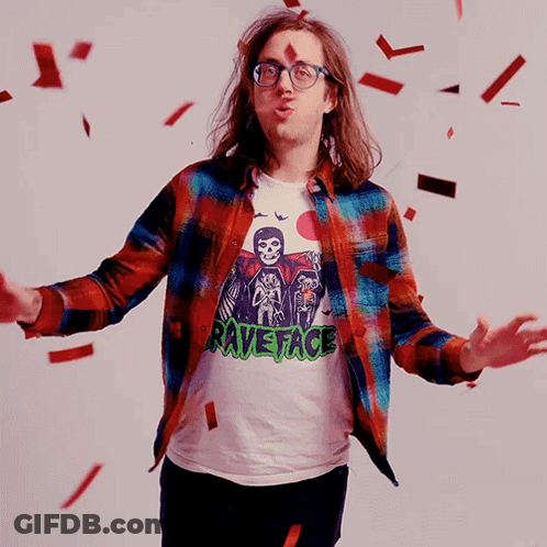 Man In Motorcycle Helmet And Plaid Shirt Raising Arms GIF