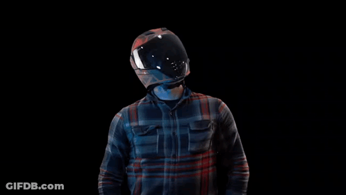 Man In Motorcycle Helmet And Plaid Shirt Raising Arms GIF