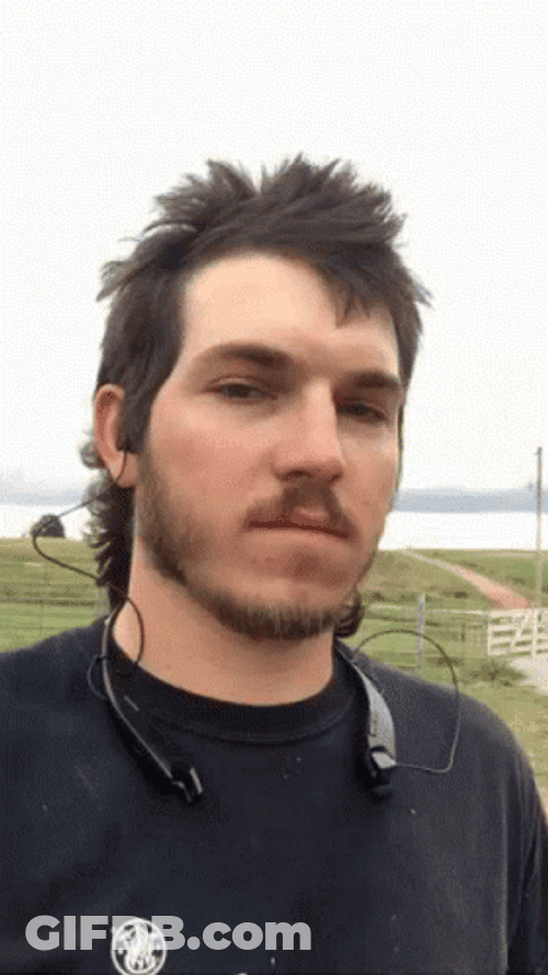 Man In Mullet Hair Smirking GIF