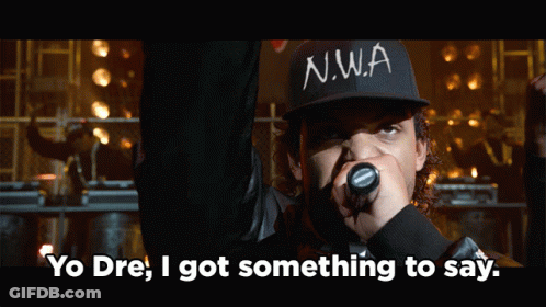 Man In N.W.A Hat Holding Microphone Saying Yo Dre GIF
