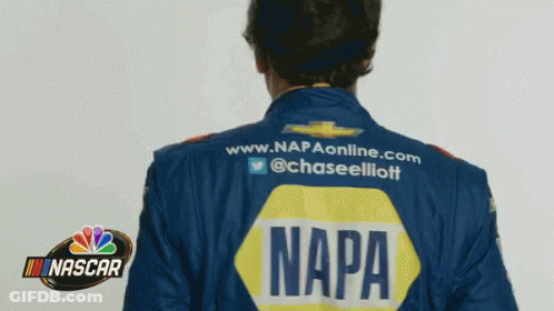 Man In Napa Jacket Near NASCAR Sign GIF