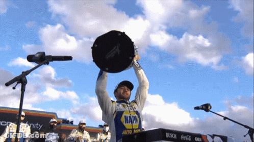 Man In Napa Shirt Holding Trophy GIF