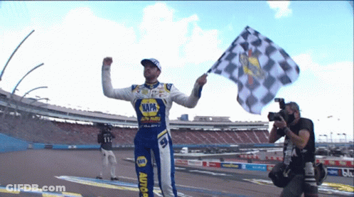 Man In Napa Uniform Holding Checkered Flag GIF