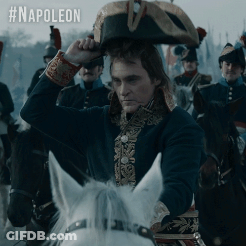 Man In Napoleon Hat Riding Horse GIF
