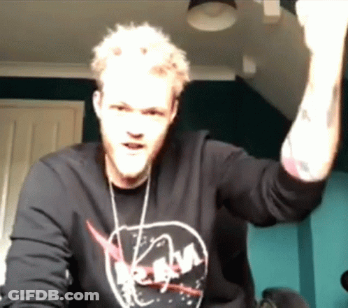 Man In NASA Shirt Raising Fist GIF