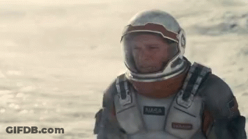 Man In NASA Space Suit In Desert GIF