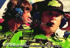 Man In NASCAR Shirt Talking To Man In Headphones GIF