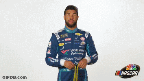 Man In NASCAR Uniform Holding Yellow Object GIF