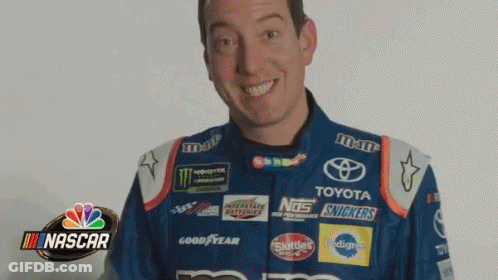 Man In Nascar Uniform Smiling Holding Snickers Bottle GIF