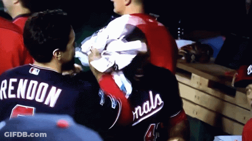 Man In Nationals Jersey Holding Towel Over Head GIF