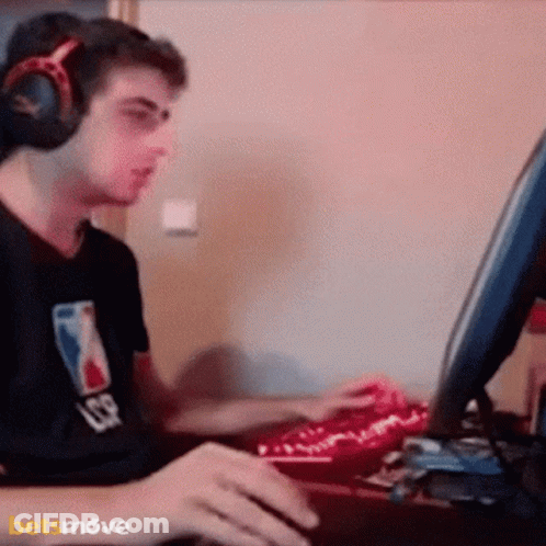 Man In NBA Shirt And Headphones Playing Video Game GIF