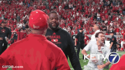 Man In Nebraska Shirt On Field GIF
