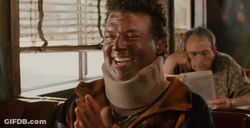 Man In Neck Brace Laughing And Clapping GIF