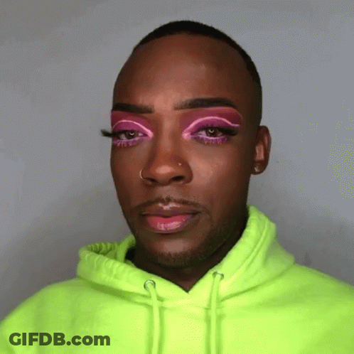 Man In Neon Green Hoodie With Pink Eyeshadow GIF