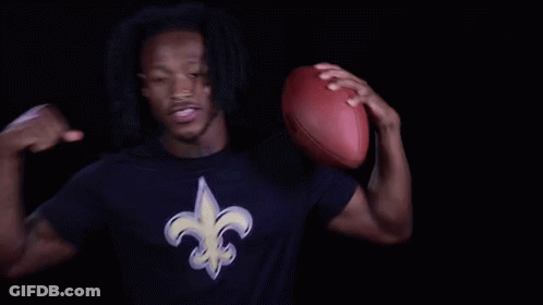Man In New Orleans Saints Shirt Holding Football GIF