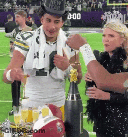 Man In New Year's Hat Standing On Football Field GIF