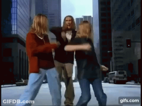 Man In New York Shirt Kissing Woman's Neck GIF
