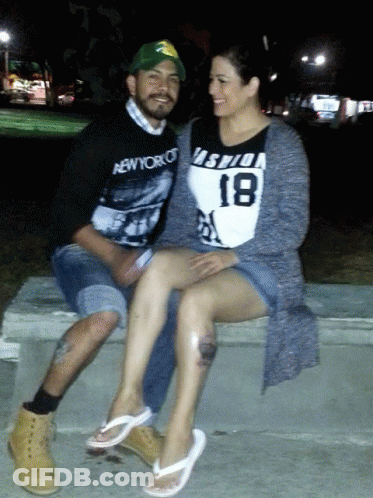 Man In New York Shirt Next To Woman In Number 18 Shirt GIF