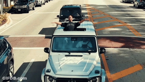 Man In New York T-Shirt Driving Mercedes GIF
