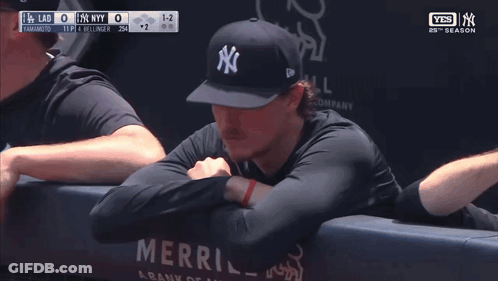 Man In New York Yankees Hat Leaning Against Wall GIF