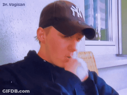Man In New York Yankees Hat Smoking GIF