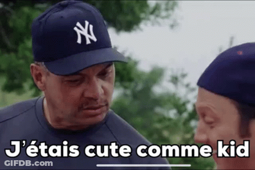 Man In New York Yankees Hat Talking To Another Man GIF