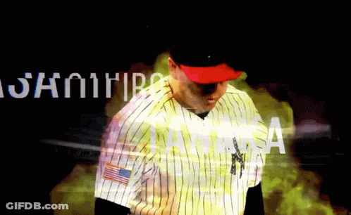 Man In New York Yankees Uniform Standing By Samurai Sign GIF