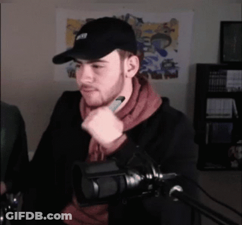 Man In NFL Hat At Microphone GIF