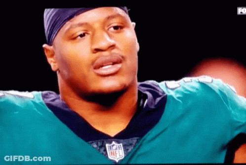 Man In NFL Jersey On TV Screen GIF