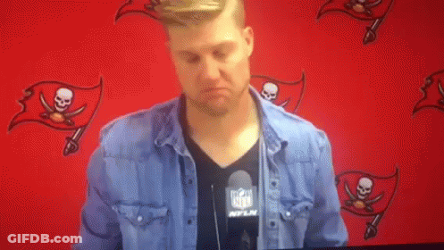Man In NFL Shirt Standing At Red Wall GIF