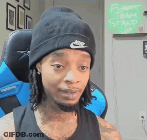 Man In Nike Beanie Sitting In Chair GIF