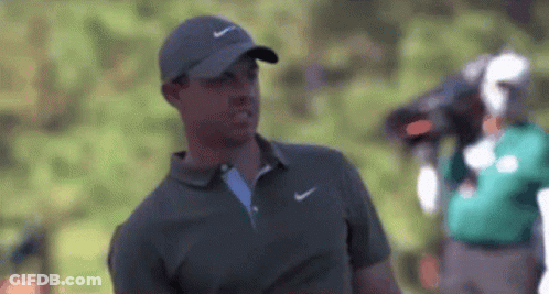 Man In Nike Hat And Polo Shirt On Golf Course GIF