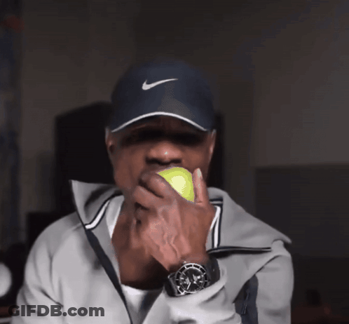 Man In Nike Hat Holding Tennis Ball GIF