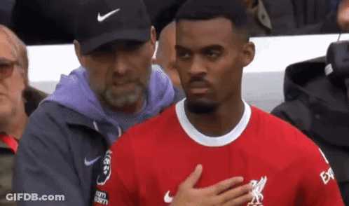 Man In Nike Hat Next To Man In Red Shirt GIF