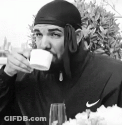 Man In Nike Jacket Drinking From Cup GIF