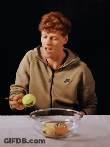 Man In Nike Jacket Holding Tennis Ball GIF