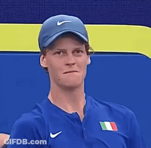 Man In Nike Jacket Holding Tennis Ball GIF