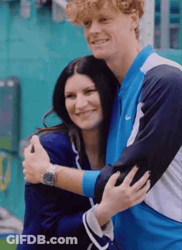 Man In Nike Jacket Hugging Woman In Blue Jacket GIF