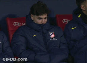 Man In Nike Jacket Sitting In Red Chairs GIF
