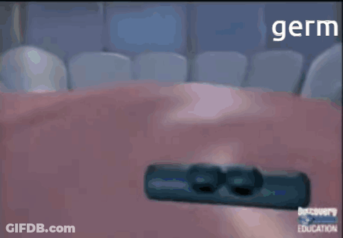 Man In Nike Jacket Standing Before Black Wall GIF