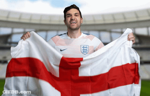 Man In Nike Shirt Holding Flag With Cross GIF