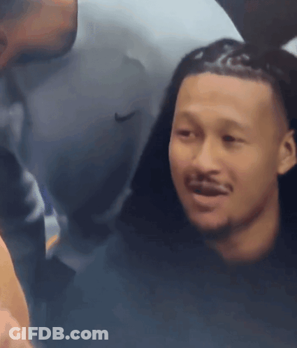 Man In Nike Shirt Looking At Another Man GIF