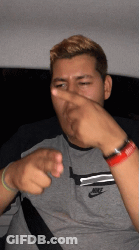 Man In Nike Shirt Pointing GIF