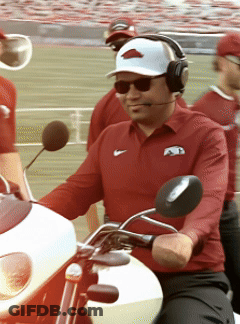 Man In Nike Shirt Riding White Motorcycle GIF