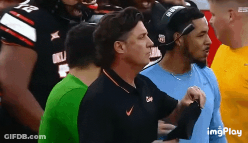 Man In Nike Shirt Standing In Crowd GIF