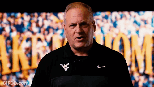 Man In Nike Shirt Standing In Front Of Crowd GIF