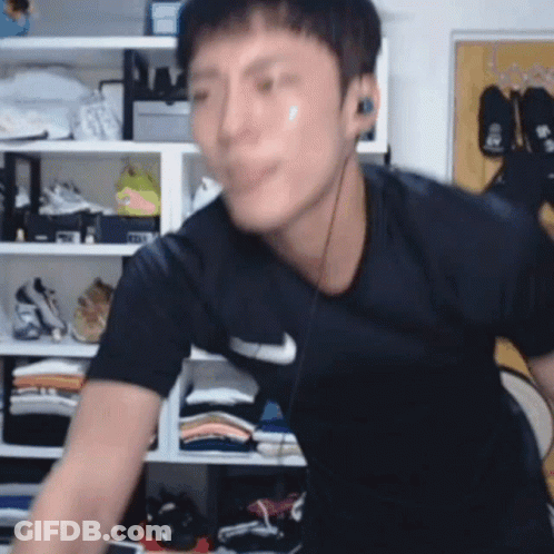 Man In Nike Shirt With Headphones GIF